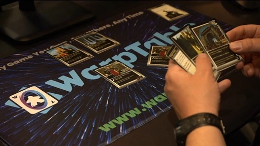 Promo image showing cards from an example game being laid on an official WarpTable playmat