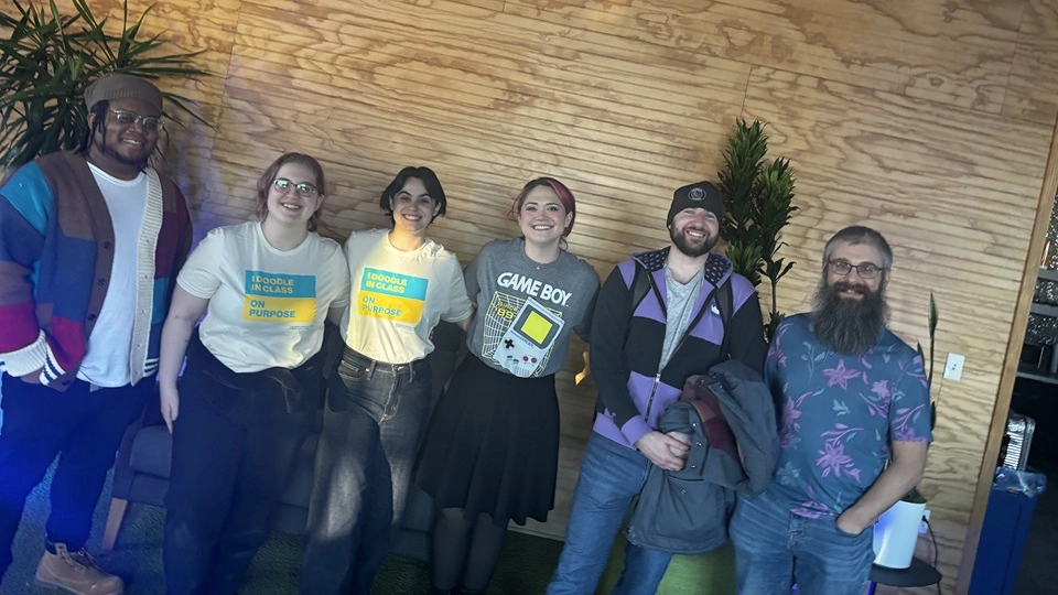 Photo of the team that I worked with at the game jam venue. From left to right: Jalon (our musician and sound designer), Madison and Abby (our two character/background artists), Chloe (our game designer and UI artist), myself (programmer and Unity generalist), and Sean (our other programmer).
